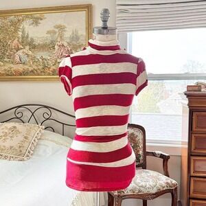 y2k papaya fits like a small red and cream striped turtleneck